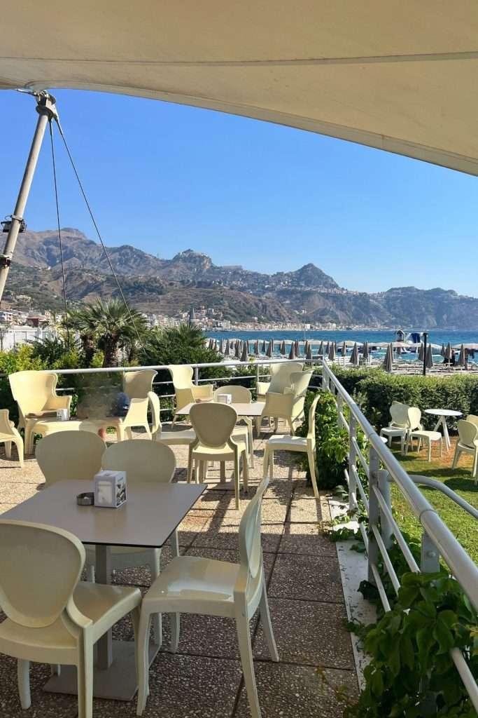 restaurant with taormina in the background